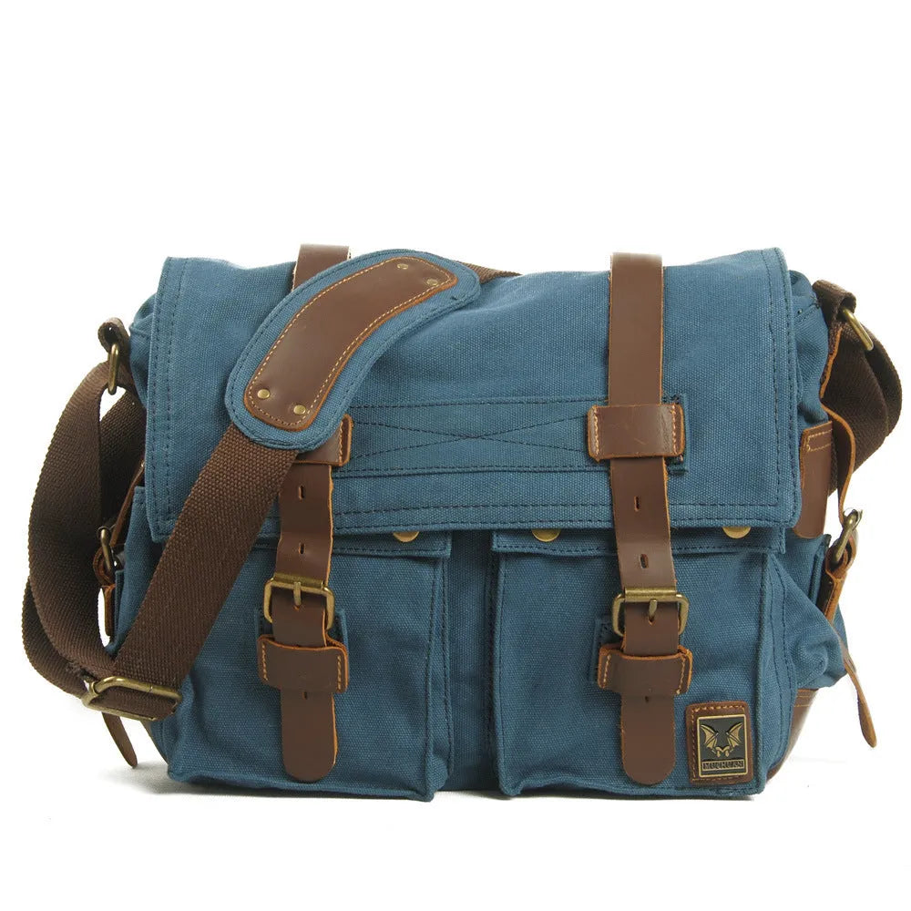 Men's canvas crossbody shoulder bag with cowhide accents and flap closure in retro postman style