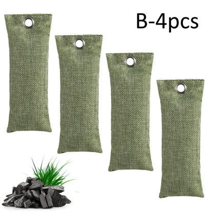 Set of black, green, grey, and blue rectangular bamboo charcoal deodorising bags on a white surface.