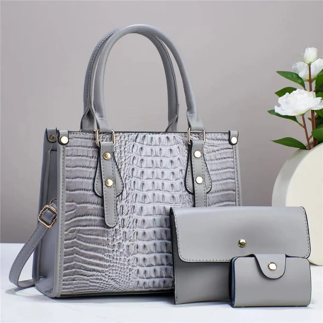 Contrast colour three-piece bag set showing bucket-shaped crossbody bag, wallet, and card holder in coordinated colours