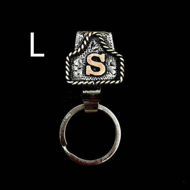 Handmade cow tag design metal keychain on a keyring, shown in one of many available colours.