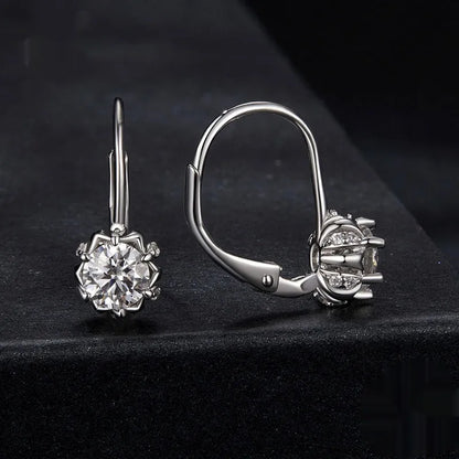 Sterling silver flower bud clip earrings with moissanite and white gold plating