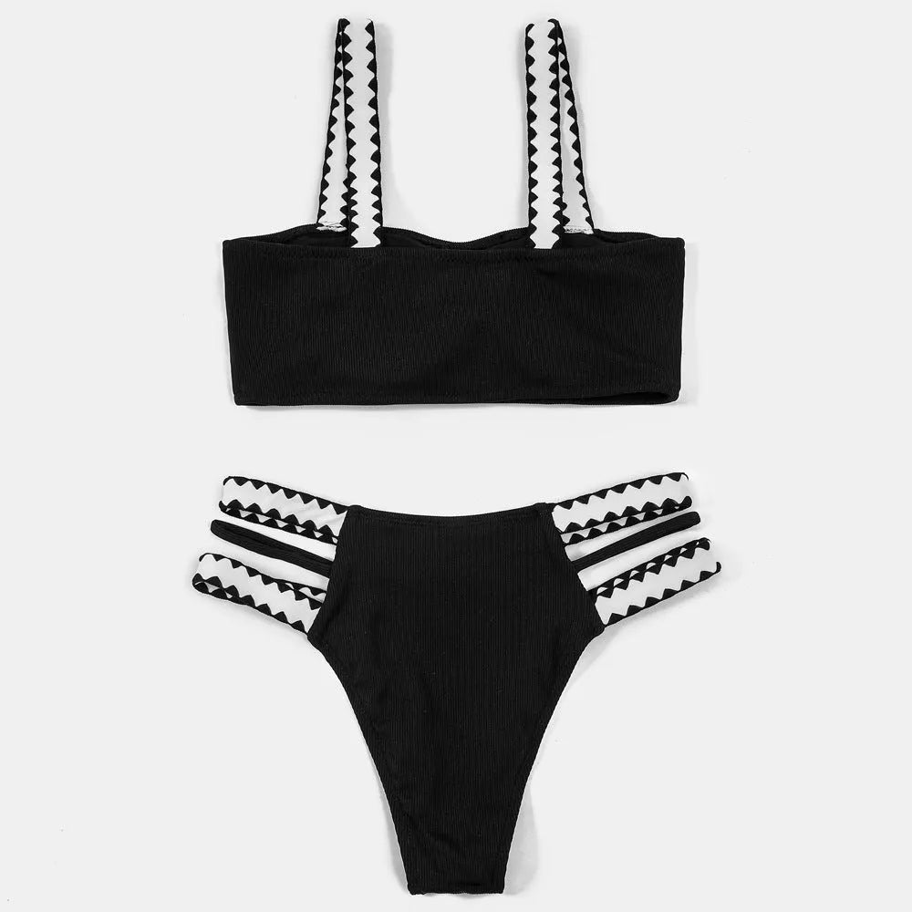 Black women's hollowed-out split swimsuit bikini set on a model.