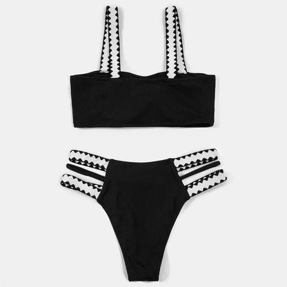 Black women's hollowed-out split swimsuit bikini set on a model.