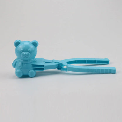 Red heart-shaped snowball maker clip for kids, perfect for winter play