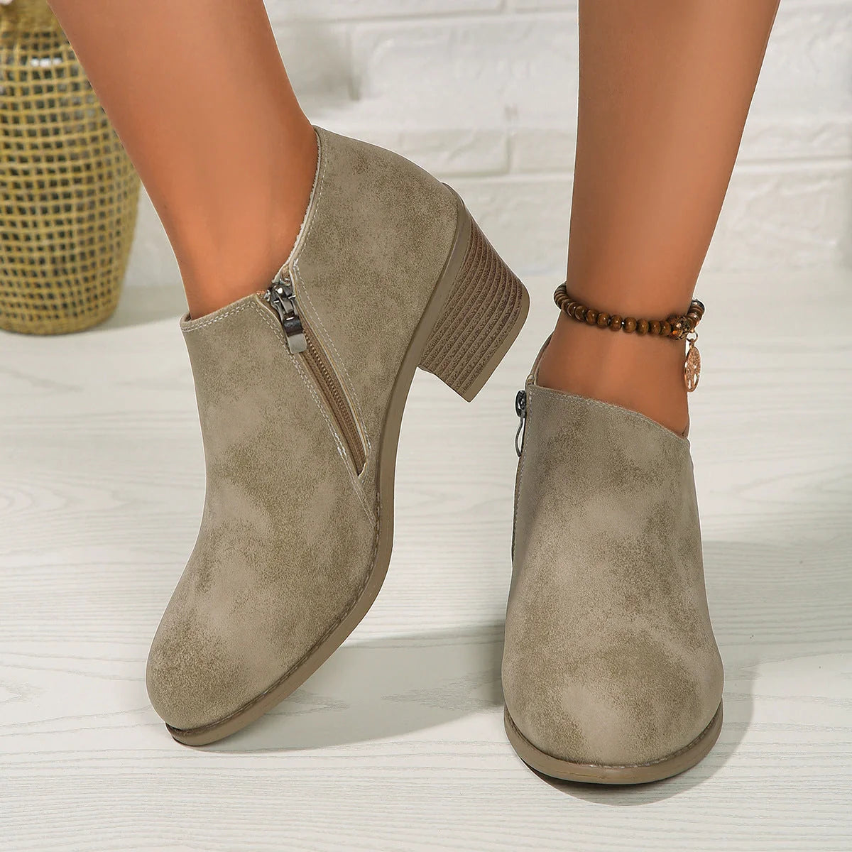 Women's chunky heel ankle boots with side zipper in blue, black, and khaki