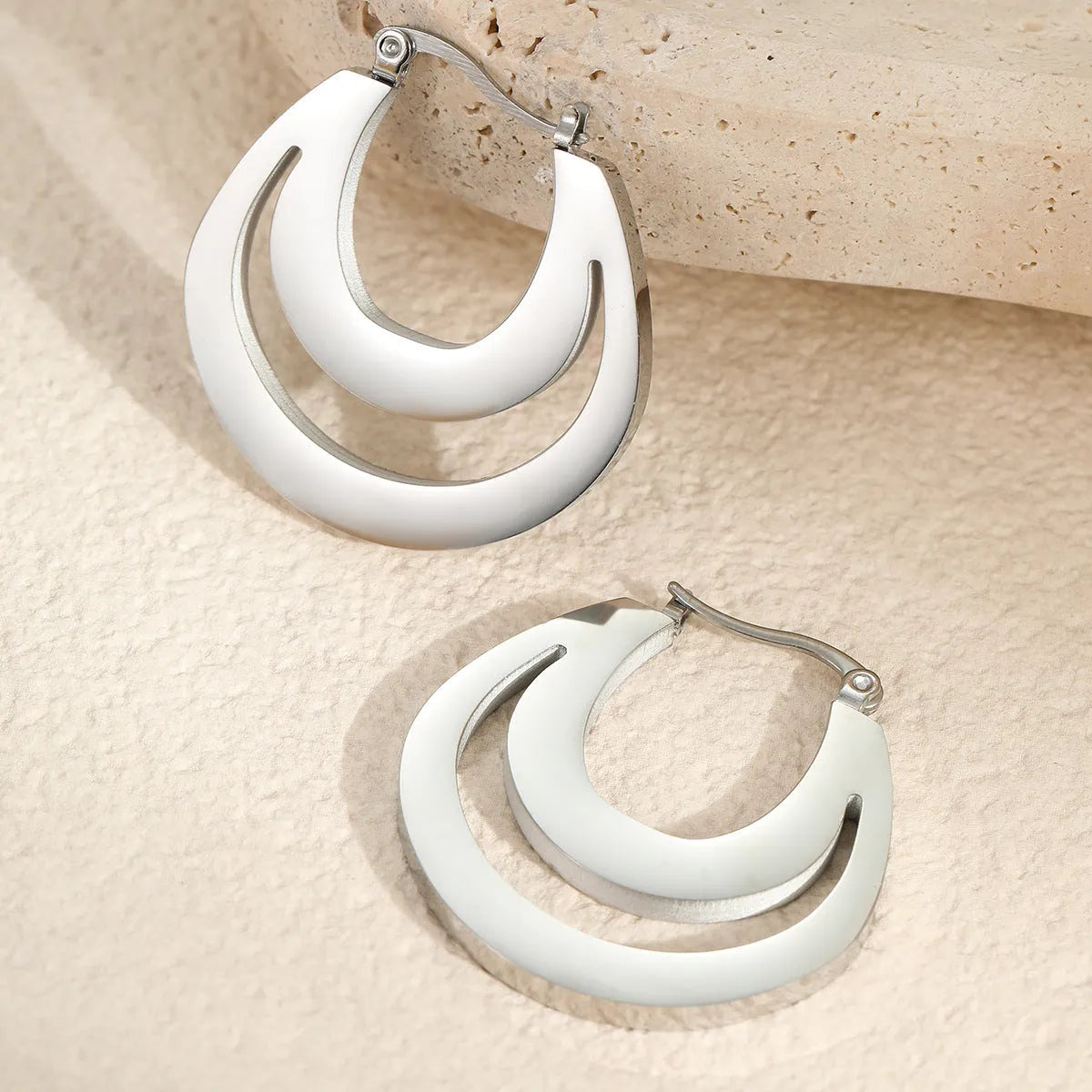Geometric French earrings with gold plating and round ring design elements