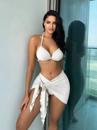 Women's black three-piece swimsuit set with Russian split design, showing top, panties, and skirt.