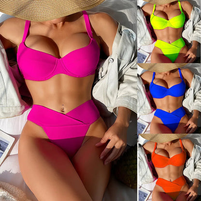 Women's solid colour split bikini swimsuit in fluorescent pink on a mannequin.