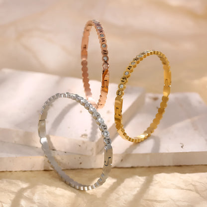 Korean style titanium steel bracelet with a numerical design element on an adjustable band.