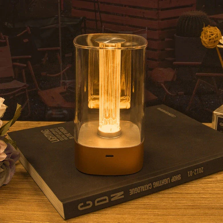Elegant touch-controlled bedside lamp with soft, warm lighting, unique lamp post design, and wireless USB charging