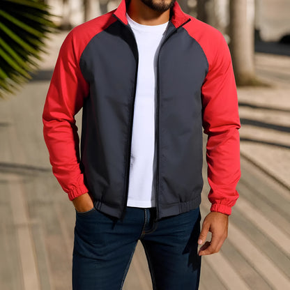 Man wearing a green loose-fit casual jacket with a stand collar and raglan long sleeves.