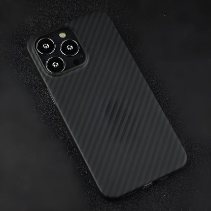 Matt black Kevlar fibre iPhone case with volcano crater texture shown on an iPhone 14 Pro.