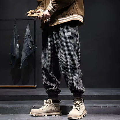 Men's grey ankle-tied sweatpants with straight leg cut and non-ironing fabric