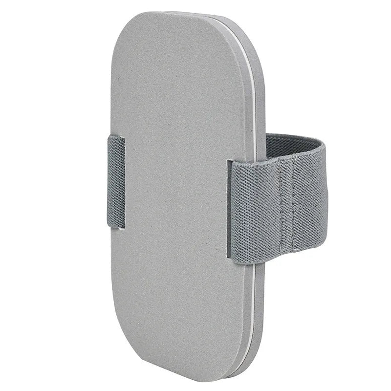 Grey pet nail grooming tool with detachable grinding board and scraper on EVA foam base