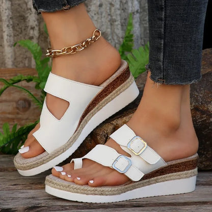 White patent leather wedge sandals with woven design and peep toe on rubber sole