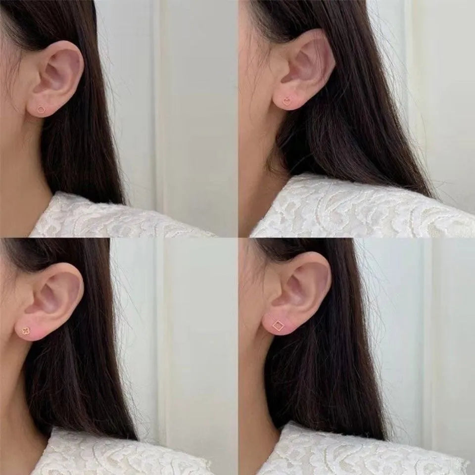 Pair of small spiral geometric ear studs with gold hollow thread finish in mixed material, shown in eight shape options.