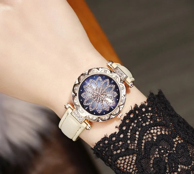 Women's diamond decorative watch with round dial showing red colour option and pin buckle clasp
