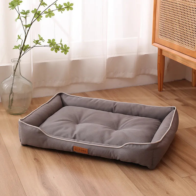 Waterproof dog sofa bed in grey Oxford cloth showing raised sides and rectangular shape