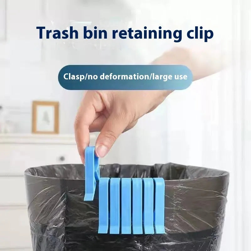 A white polypropylene plastic clip for holding a rubbish bag onto the rim of a bin.
