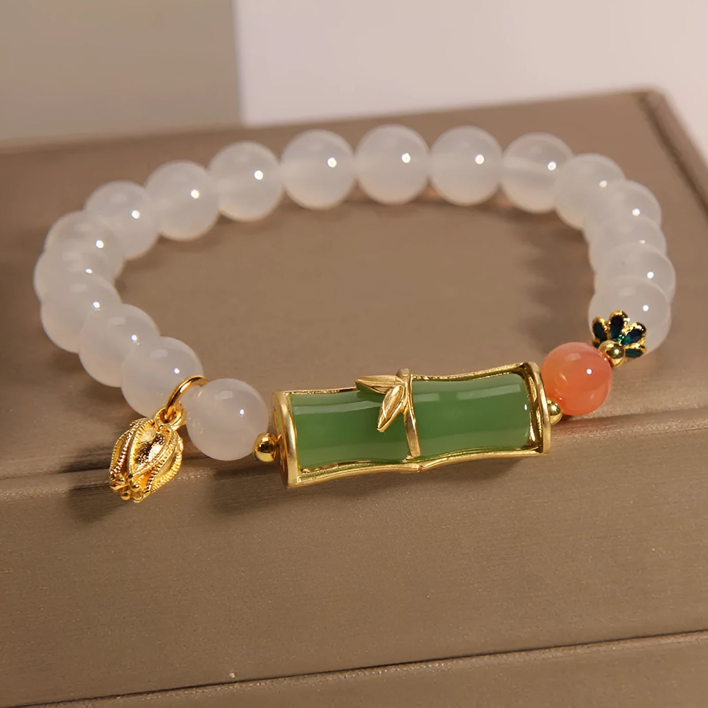 Women's white agate and jade bamboo bead bracelet in retro Chinese style.