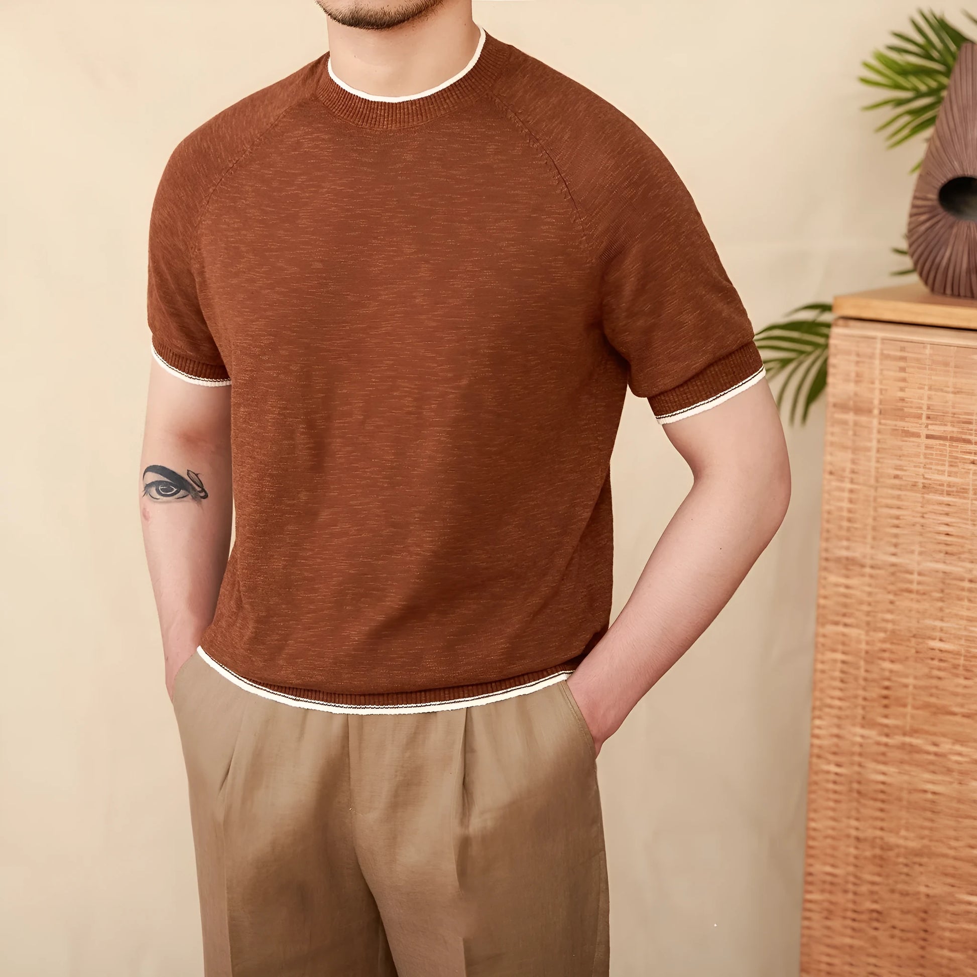 Brown linen-cotton blend casual T-shirt with round neck and short sleeves on a hanger