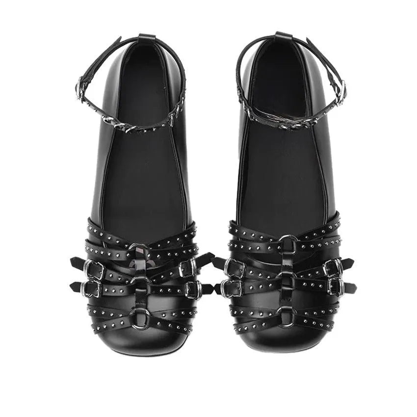 Women's black patent leather retro pumps with square toe and buckle closure on low flat heel