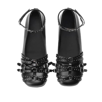 Women's black patent leather retro pumps with square toe and buckle closure on low flat heel