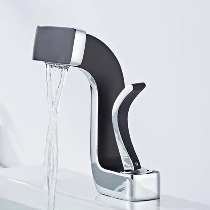 Copper vanity basin mixer tap with lift handle, shown in black and gold finish.