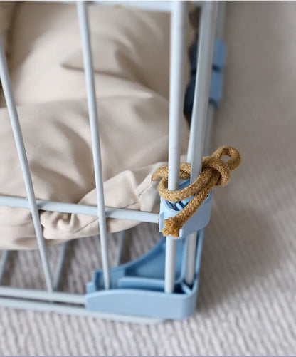Beige cage cushion for dogs tied inside a metal crate, shown next to coffee and orange colour options.