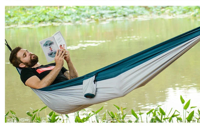Premium double hammock made with soft, breathable fabric and reinforced ropes for outdoor use