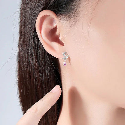 Butterfly shaped silver stud earrings with Swarovski crystal details on wings