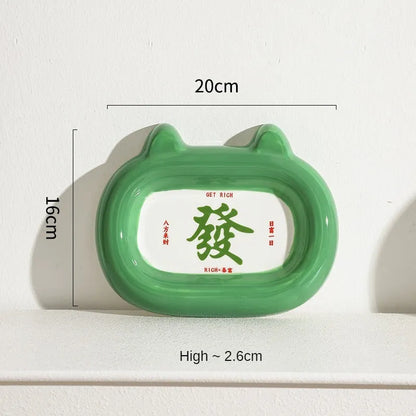 Four ceramic animal-themed pet bowls with frog, panda, pig, and fortune cat designs and silicone non-slip bases