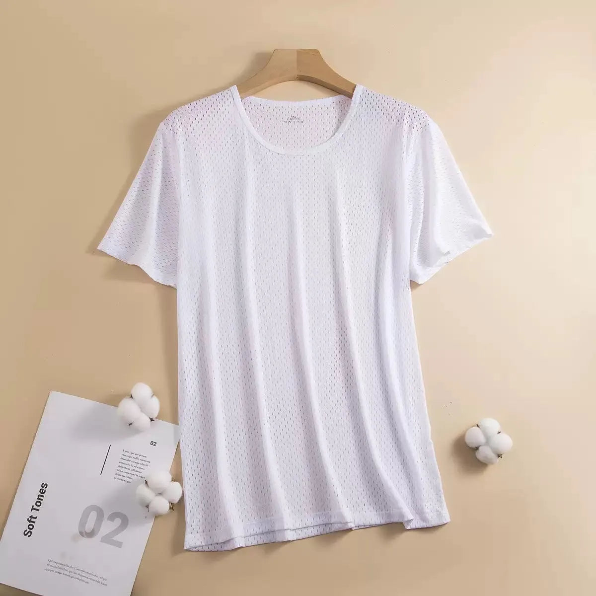 Man wearing a solid colour ice silk short sleeve t-shirt with a crew neck in a loose, casual fit for summer.
