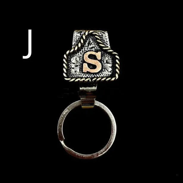 Handmade cow tag design metal keychain on a keyring, shown in one of many available colours.