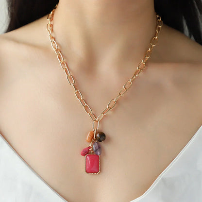 Elegant pendant necklace with a modern geometric design in vibrant colours, perfect for the discerning British woman.
