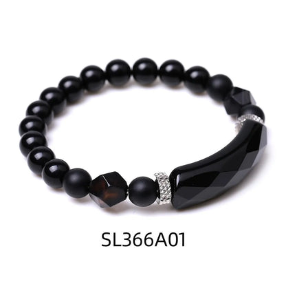 Handmade diamond-shaped cut black agate geometric bracelet showing fan-shaped bead arrangement.