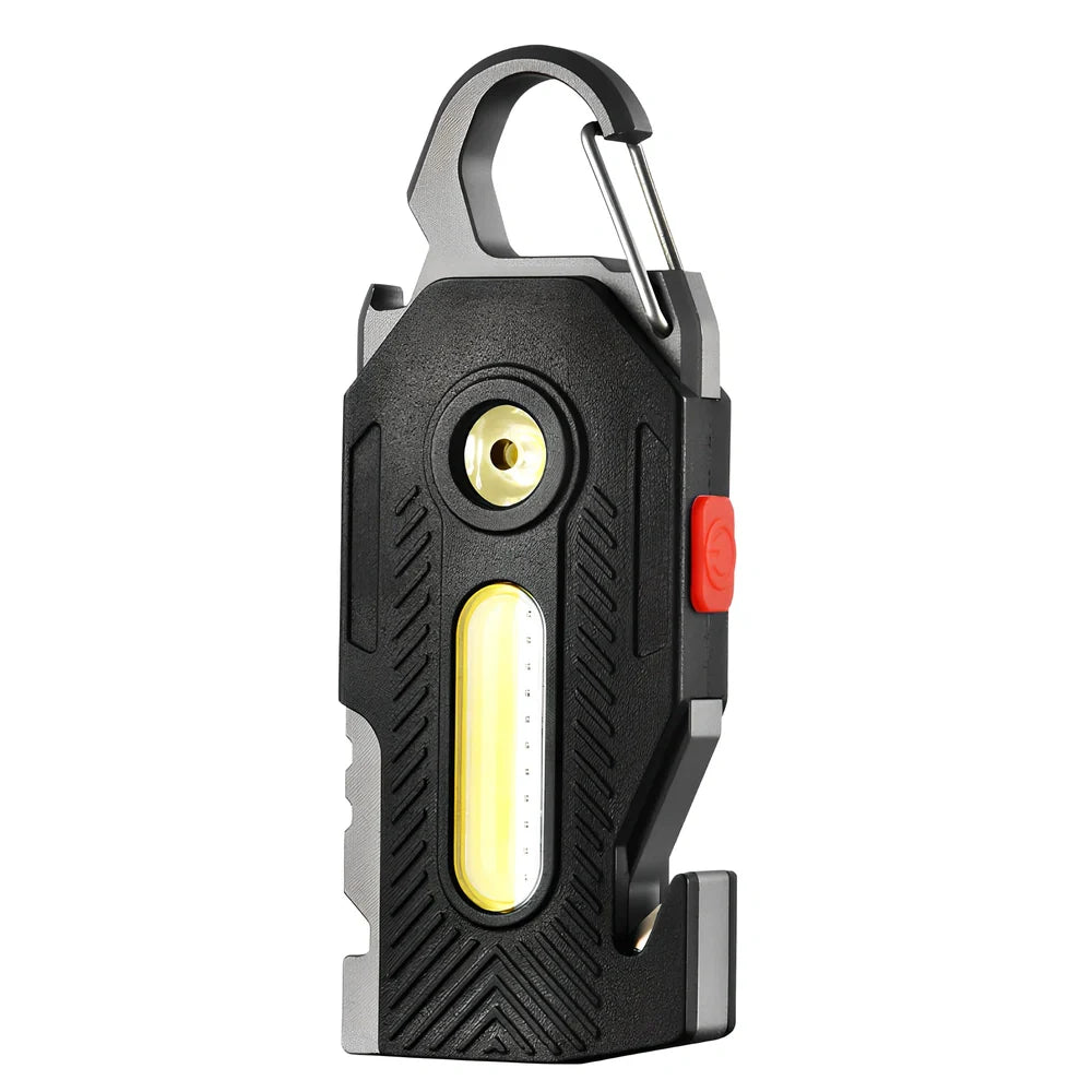 Multifunctional emergency light with mountaineering buckle showing bottle opener and seat belt cutter tools