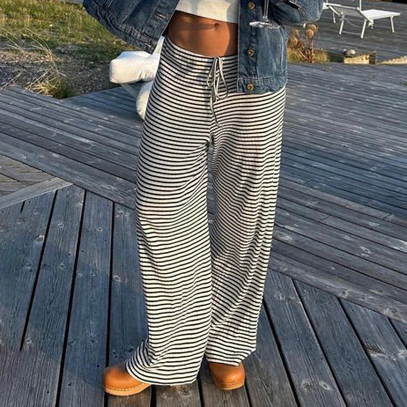 Stylish women's striped wide-leg trousers with lace-up detail in various colors