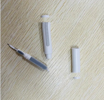 Black and white plastic earbud cleaning pen with a brush for headphones and mobile phones