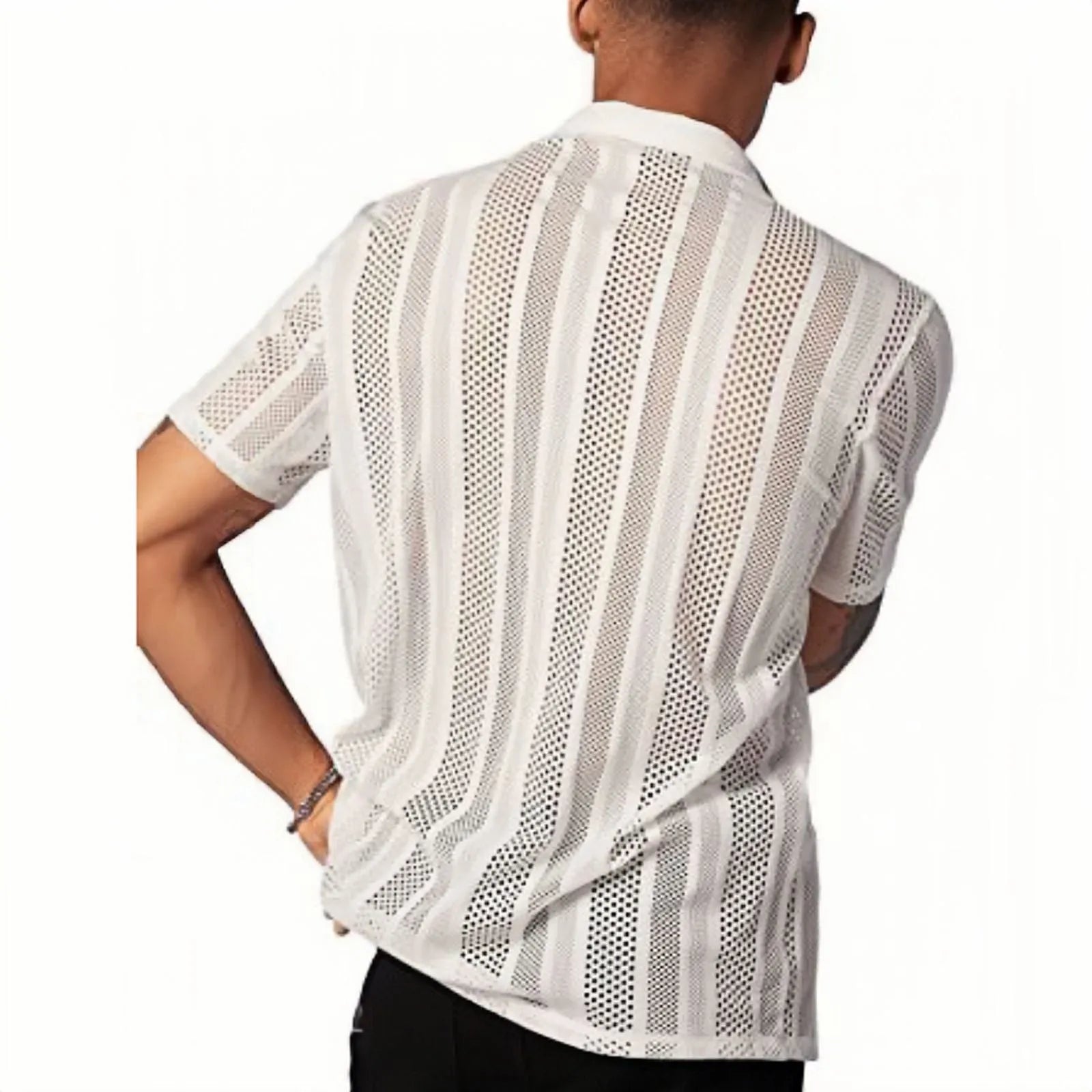 Man wearing a black short-sleeved knitted button-up shirt with a jacquard textured pattern.
