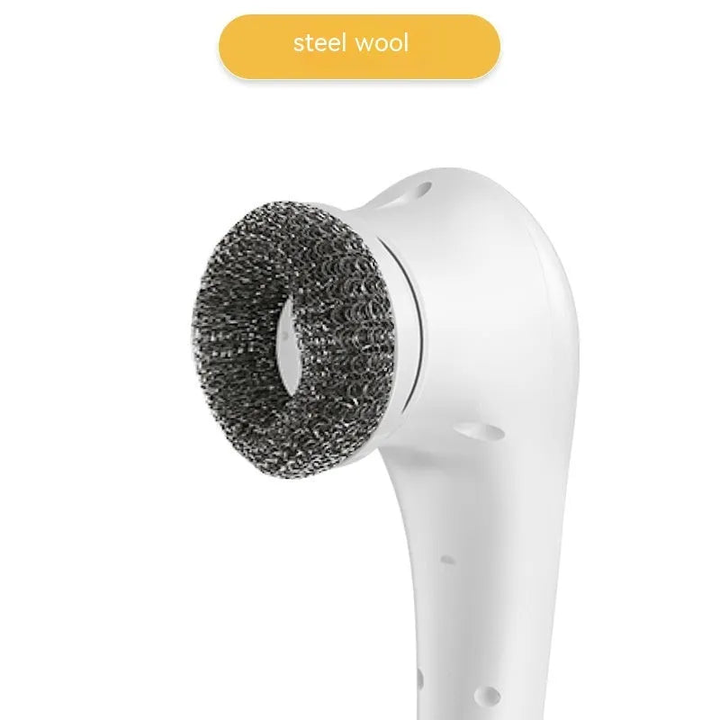 White cordless electric handheld scrubber with five attached brush heads on a kitchen counter