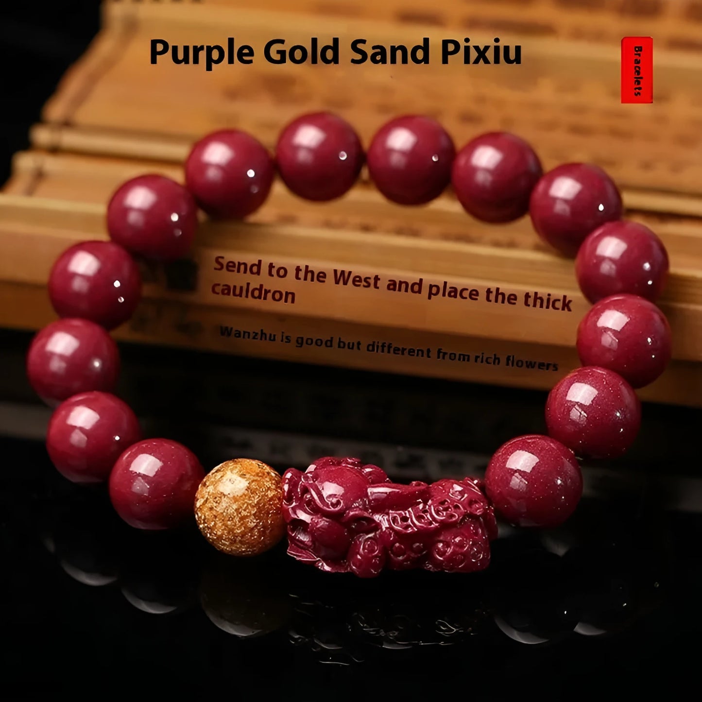 Purple gold sandstone cinnabar bracelet with totem design on a wrist, showing polished beads.