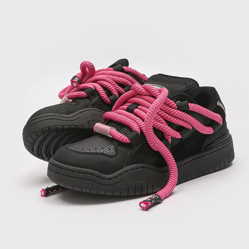 Low-top unisex casual shoes in denim blue with a round toe, thick rubber sole, and front lace-up closure.