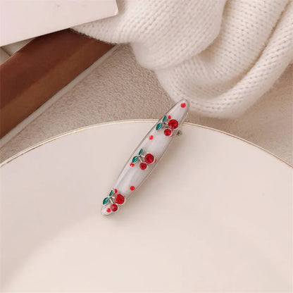 Red love heart-shaped hair barrette clip with retro white dots on a willow leaf-shaped base.