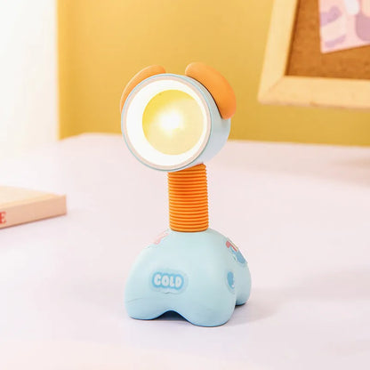 Colourful cartoon character magnetic DIY night light on a desk with adjustable head.