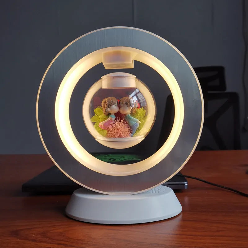 Pink rose eternal flower floating in magnetic levitation LED night light with triangular base and touch control