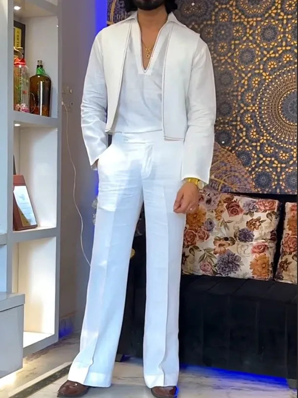 White three-piece outfit with V-neck shirt, sleeveless vest and trousers on hanger