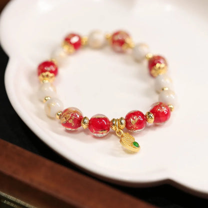 Women's geometric ethnic style bracelet with gold foil decoration on coloured glaze in two colour variations
