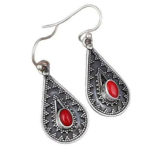 Gemstone earrings in a drop shape with European and American national style design made from zinc alloy with red pine gemstone details, a silver-coloured retro accessory suitable for female wearers.