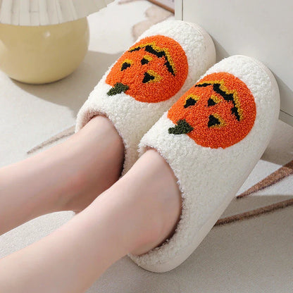 Cozy pumpkin cartoon slippers with soft suede uppers and plush cotton linings for comfortable indoor wear